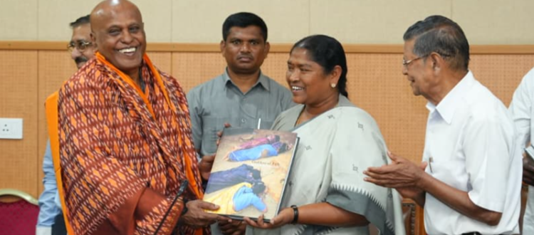 seethakka launches medaram festival coffee table book